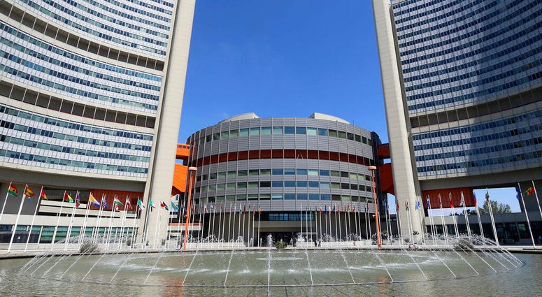 FILE - In this June 18, 2014, file photo flags fly outside the United Nations building in Vienna, Austria. (AP Photo/Ronald Zak, File) FILE - In this June 18, 2014, file photo flags fly outside the United Nations building in Vienna, Austria. (AP Photo/Ronald Zak, File)