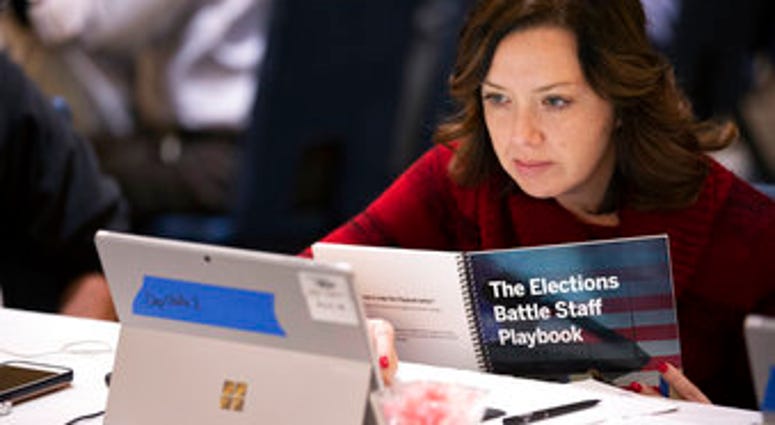 In this Monday, Dec. 16, 2019, photo, Mandy Vigil, from New Mexico, works during an exercise run by military and national security officials, for state and local election officials to simulate different scenarios for elections. (AP Photo/Alex Brandon) In this Monday, Dec. 16, 2019, photo, Mandy Vigil, from New Mexico, works during an exercise run by military and national security officials, for state and local election officials to simulate different scenarios for elections. (AP Photo/Alex Brandon)