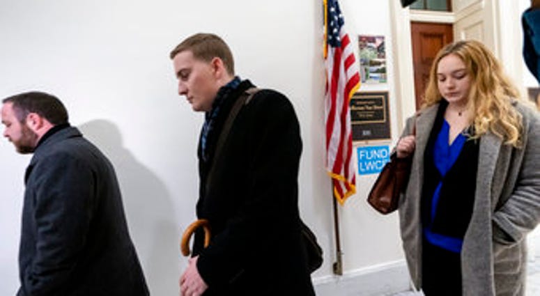 Deputy Chief of Staff Justin O'Leary, center, joins other top aides to Jeff Van Drew, a House Democrat who plans to switch and become a Republican, as leave their office after turning in their joint letter of resignation. (AP Photo/J. Scott Applewhite) Deputy Chief of Staff Justin O'Leary, center, joins other top aides to Jeff Van Drew, a House Democrat who plans to switch and become a Republican, as leave their office after turning in their joint letter of resignation. (AP Photo/J. Scott Applewhite)