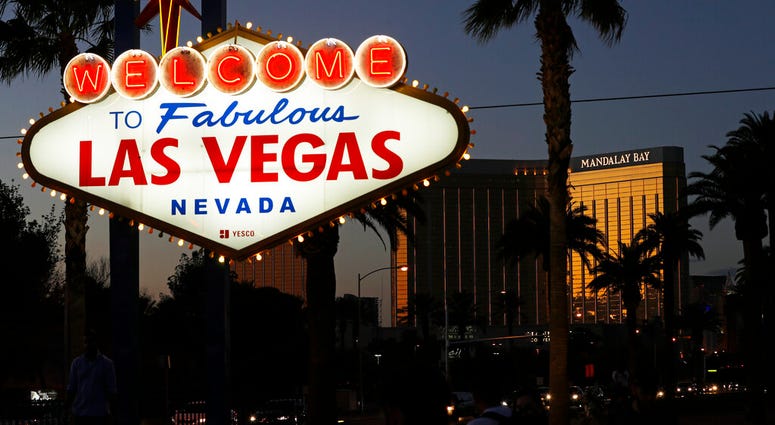 FILE - Sept. 21, 2018, file photo. The family of a woman killed by a gunman raining down gunfire from the Las Vegas high-rise hotel suite filed a wrongful death lawsuit Tuesday, July 2, 2019. (AP Photo/John Locher, File)