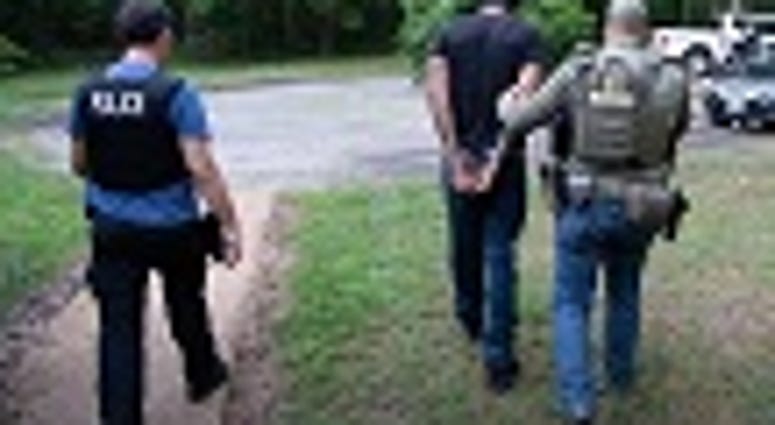 An arrest is made during Operation Washout, an operation involving local, state, and federal law enforcement. (Shane T. McCoy / US Marshals)