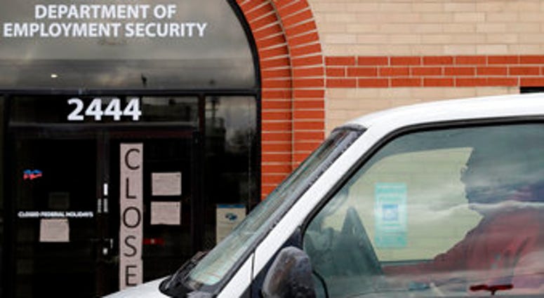 A man looks at the closed sign in front of Illinois Department of Employment Security in Chicago, Wednesday, April 15, 2020. (AP Photo/Nam Y. Huh) A man looks at the closed sign in front of Illinois Department of Employment Security in Chicago, Wednesday, April 15, 2020. (AP Photo/Nam Y. Huh)
