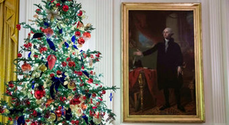 A decorated tree stands next to the portrait of President George Washington in the East Room during the 2019 Christmas preview at the White House, Monday, Dec. 2, 2019, in Washington. (AP Photo/Alex Brandon) A decorated tree stands next to the portrait of President George Washington in the East Room during the 2019 Christmas preview at the White House, Monday, Dec. 2, 2019, in Washington. (AP Photo/Alex Brandon)