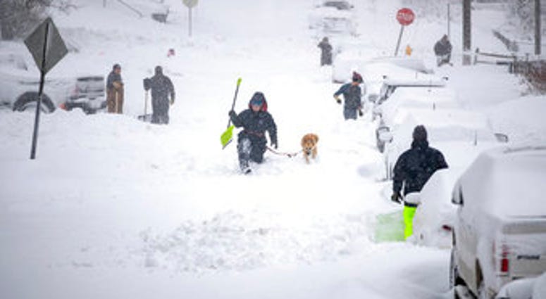 Neighbors work together in an effort to clear out as much snow as possible from E. 8th Street, Sunday, Dec. 1, 2019, in Duluth, Minn. (Alex Kormann/Star Tribune via AP) Neighbors work together in an effort to clear out as much snow as possible from E. 8th Street, Sunday, Dec. 1, 2019, in Duluth, Minn. (Alex Kormann/Star Tribune via AP)