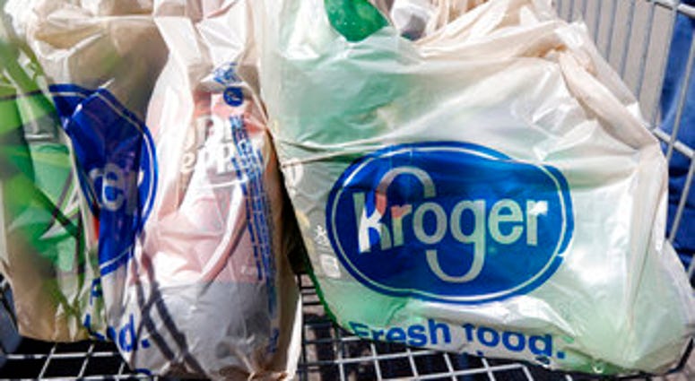 FILE - In this June 15, 2017, file photo, bagged purchases from the Kroger grocery store in Flowood, Miss., sit inside this shopping cart. (AP Photo/Rogelio V. Solis, File) FILE - In this June 15, 2017, file photo, bagged purchases from the Kroger grocery store in Flowood, Miss., sit inside this shopping cart. (AP Photo/Rogelio V. Solis, File)