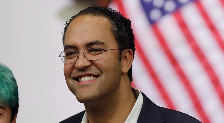 FILE - In this Oct. 23, 2018, file photo, Rep. Will Hurd, R-Texas, right, poses for photos at the Texas A&M-San Antonio. Hurd announced on Aug. 1, 2019, he will not seek reelection in 2020. (AP Photo/Eric Gay)