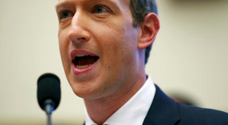 Facebook CEO Mark Zuckerberg testifies before a House Financial Services Committee hearing on Capitol Hill in Washington. (AP Photo/Andrew Harnik)