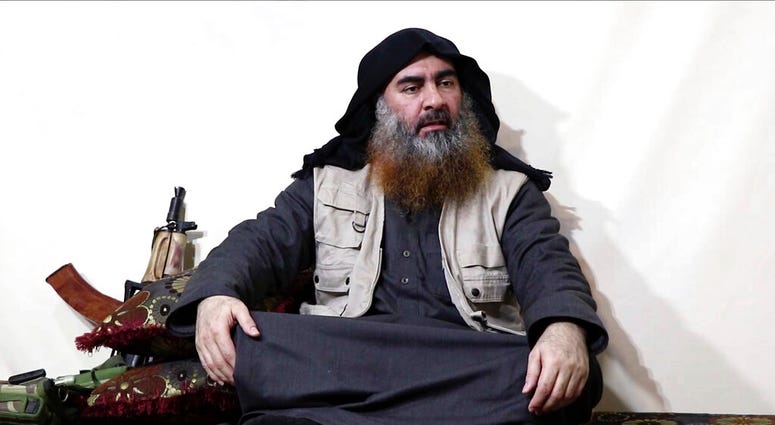 FILE - This file image made from video posted on a militant website April 29, 2019, purports to show the leader of the Islamic State group, Abu Bakr al-Baghdadi being interviewed by his group's Al-Furqan media outlet. (Al-Furqan media via AP, File)