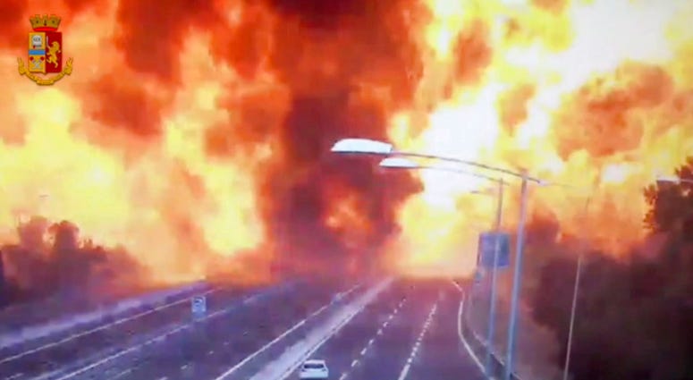 In this frame grab taken from a video released by the Italian police, the moment a truck that was transporting flammable substances explodes after colliding with another truck on a highway in the outskirts of Bologna, Italy, Monday, Aug. 6, 2018. The expl