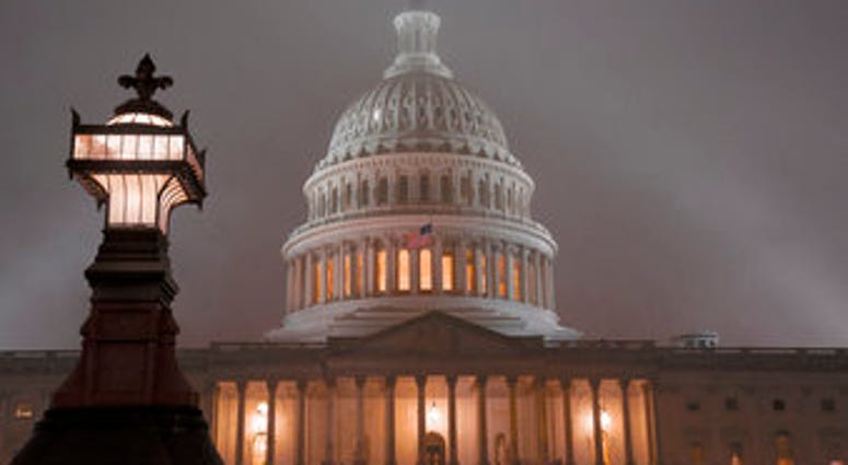 The U.S. Capitol in Washington is shrouded in mist, Friday night, Dec. 13, 2019. (AP Photo/J. Scott Applewhite) The U.S. Capitol in Washington is shrouded in mist, Friday night, Dec. 13, 2019. (AP Photo/J. Scott Applewhite)