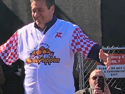 Richmond Flying Squirrels Chief Executive Chuck Domino shows off the Richmond Hush Puppies jersey on February 25, 2019. (Matt Demlein, WRVA)