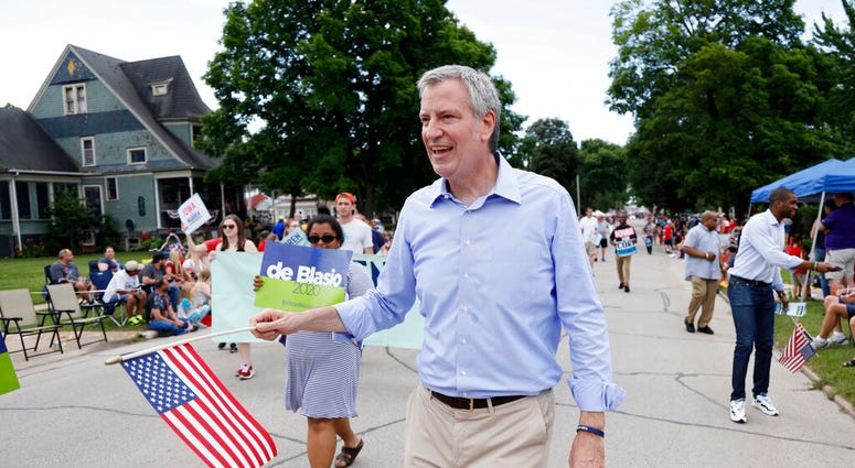 FILE - In this July 4, 2019, file photo, Democratic presidential candidate New York Mayor Bill de Blasio walks in the Independence Fourth of July parade in Independence, Iowa. (AP Photo/Charlie Neibergall, File)