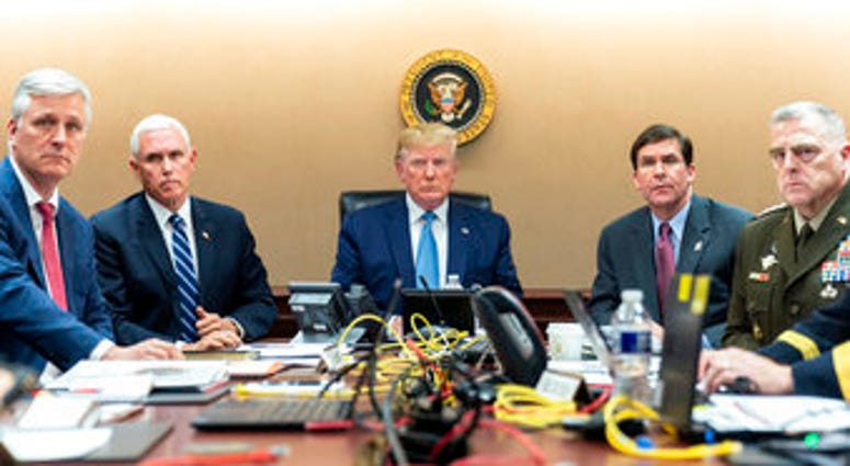 In this image released by the White House, President Donald Trump is joined by other leaders monitoring the U.S. Special Operations forces raid that took out Islamic State leader Abu Bakr al-Baghdadi.. (Shealah Craighead/White House via AP)