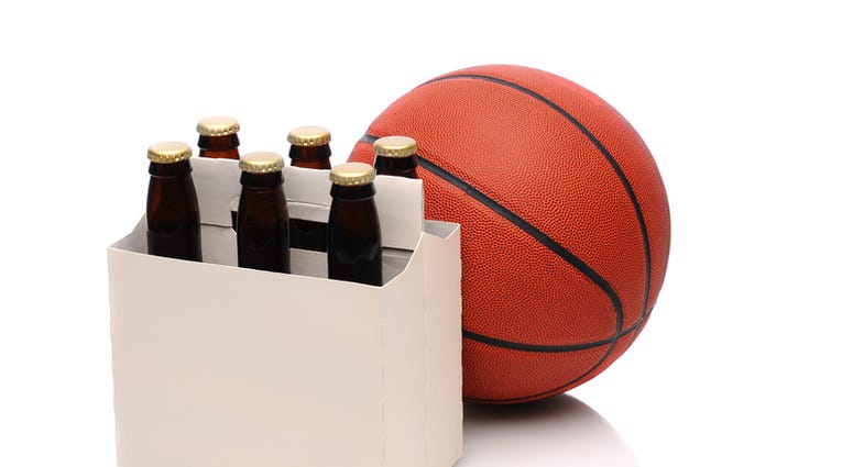 Six pack of beer bottles with a basketball. Steven Cukrov | Dreamstime.com Six pack of beer bottles with a basketball. Steven Cukrov | Dreamstime.com