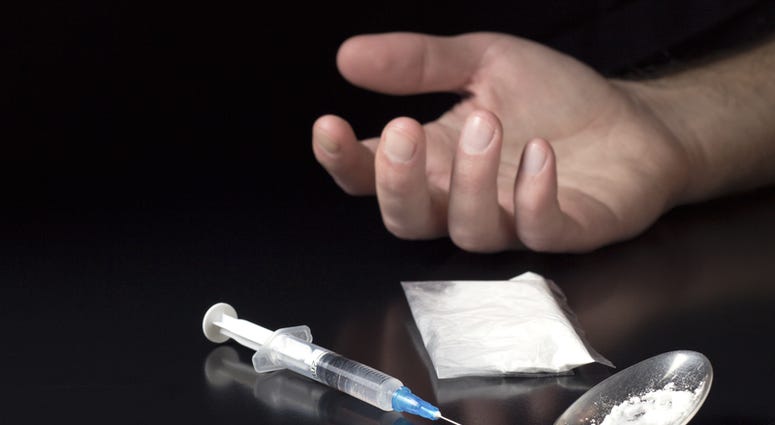 Human hand with syringe and heroin (Dreamstime) Human hand with syringe and heroin (Dreamstime)
