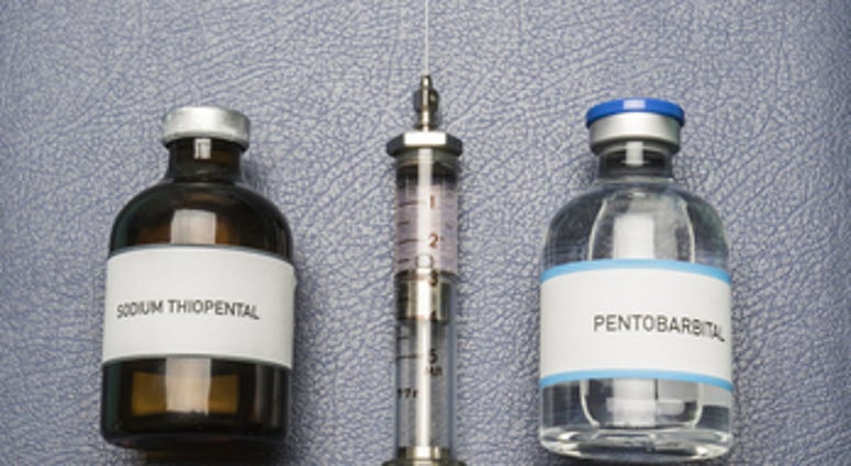 Vintage syringe and drugs used in lethal injection on a book of Lethal Injection,