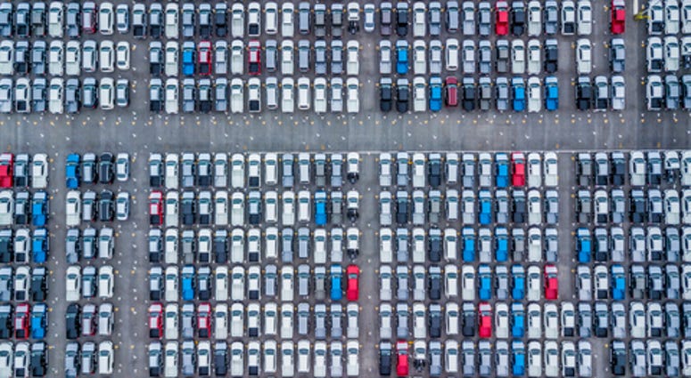 Aerial view new cars lined up in the port for import and export, Top view of new cars lined up outside an automobile factory for import & Export.