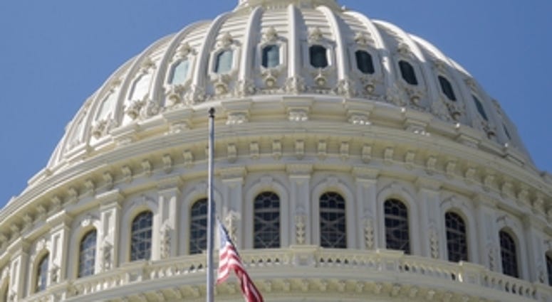 United States Capitol Building with Flag at Half Staff