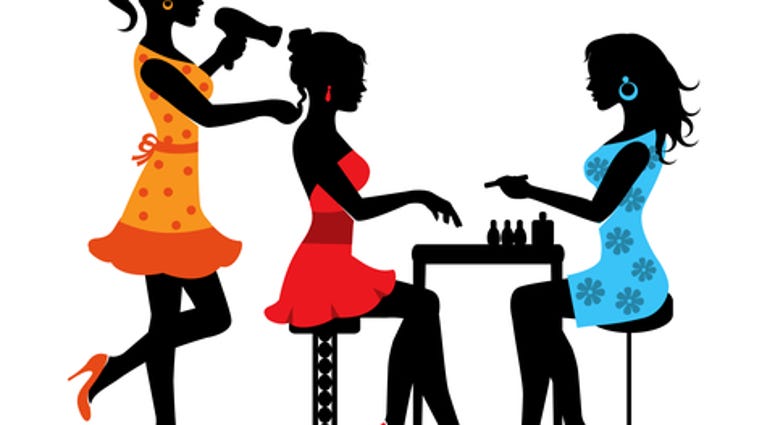 Woman in a beauty salon with a Manicurist and hairdresser