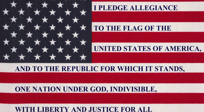 The pledge of allegiance written on the United States of America flag