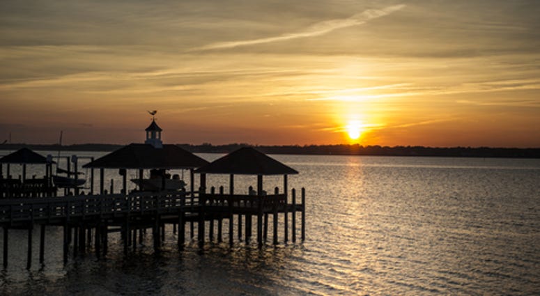 Sunset on the James River with Boat Lift in silhouette