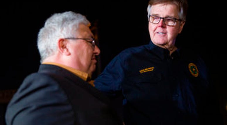 Lt. Gov. Dan Patrick, right, puts his hand on West Freeway Church of Christ senior preaching minister Britt Farmer after speaking at a news conference following a fatal shooting at his church. (Juan Figueroa/The Dallas Morning News via AP) Lt. Gov. Dan Patrick, right, puts his hand on West Freeway Church of Christ senior preaching minister Britt Farmer after speaking at a news conference following a fatal shooting at his church. (Juan Figueroa/The Dallas Morning News via AP)