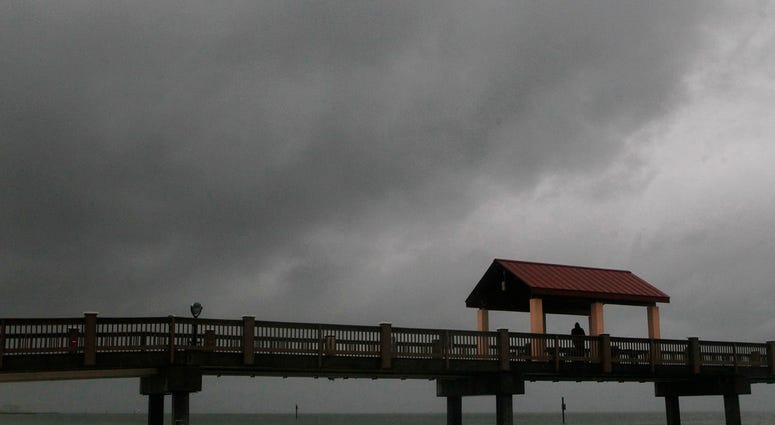 Rain falls on Clearwater Beach by Pier 60 early Sunday morning May 27, 2018, as northbound Subtropical Storm Alberto looms in the gulf to the southwest. (Jim Damaske/Tampa Bay Times via AP)