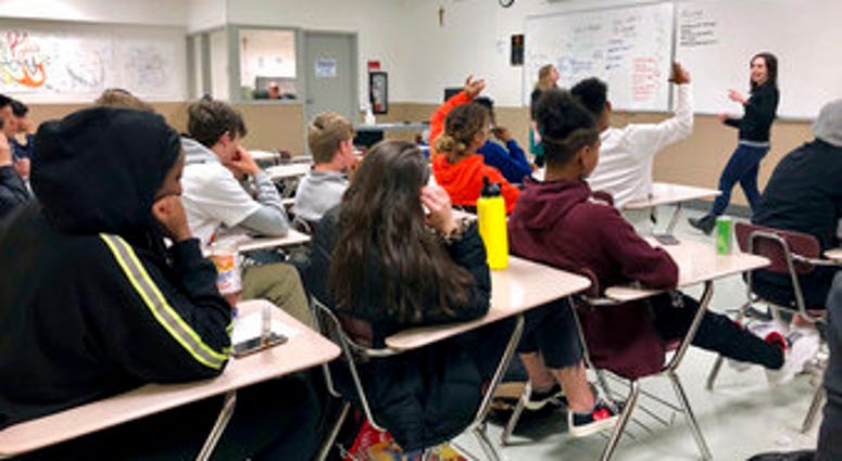 FILE - In this April 15, 2019, file photo, instructors from Raphael House lead a classroom discussion about consent and healthy relationships with a class of sophomores at Central Catholic High School in Portland, Ore. (AP Photo/Gillian Flaccus, File)