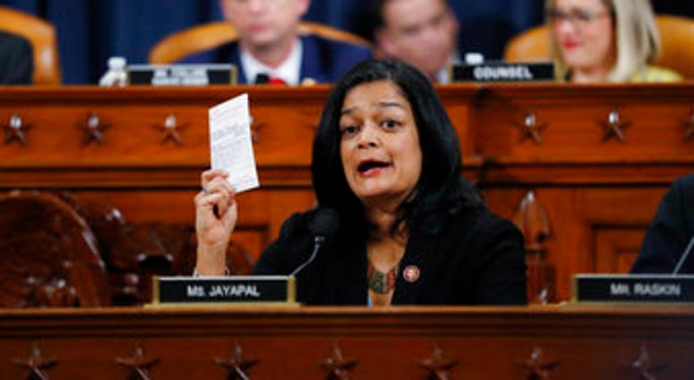Rep. Pramila Jayapal, D-Wash., holds up a copy of the U.S. Constitution as she votes on the articles of impeachment against President Donald Trump, Friday, Dec. 13, 2019, in the House Judiciary Committee on Capitol Hill. (AP Photo/Andrew Harnik) Rep. Pramila Jayapal, D-Wash., holds up a copy of the U.S. Constitution as she votes on the articles of impeachment against President Donald Trump, Friday, Dec. 13, 2019, in the House Judiciary Committee on Capitol Hill. (AP Photo/Andrew Harnik)