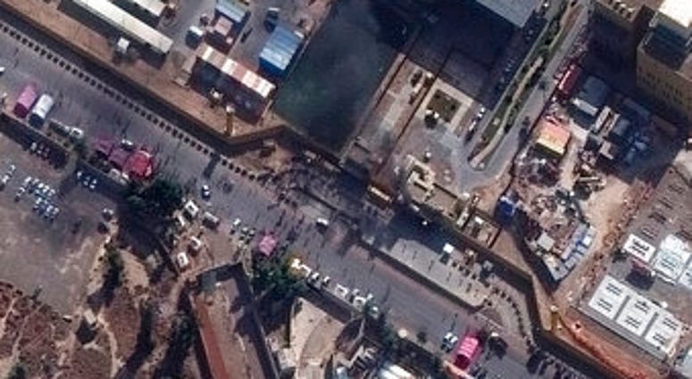 This Wednesday, Jan. 1, 2020, image provided by Maxar Technologies shows black smoke coming out of the U.S. Embassy compound in Baghdad. (Satellite image ©2020 Maxar Technologies via AP) This Wednesday, Jan. 1, 2020, image provided by Maxar Technologies shows black smoke coming out of the U.S. Embassy compound in Baghdad. (Satellite image ©2020 Maxar Technologies via AP)
