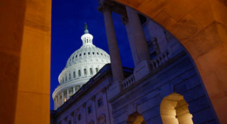 Light shines on the U.S. Capitol dome in Washington, early Wednesday, Dec. 4, 2019, prior to scheduled testimony from Constitutional law experts at a hearing before the House Judiciary Committee. (AP Photo/Patrick Semansky) Light shines on the U.S. Capitol dome in Washington, early Wednesday, Dec. 4, 2019, prior to scheduled testimony from Constitutional law experts at a hearing before the House Judiciary Committee. (AP Photo/Patrick Semansky)