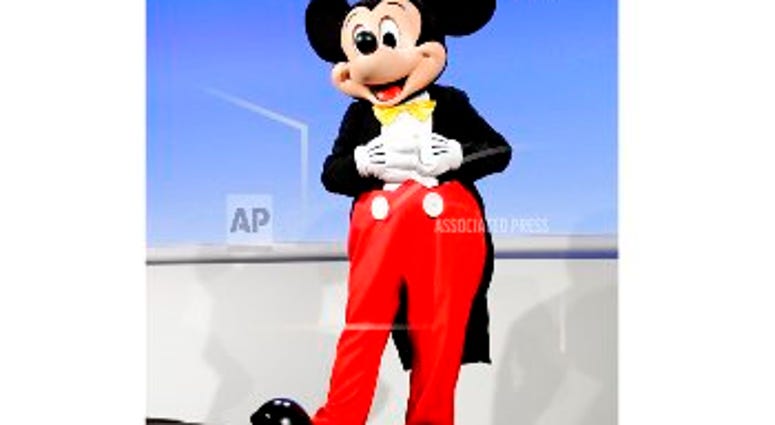 In this Jan. 4, 2017 file photo, the Disney character Mickey Mouse appears at CES International in Las Vegas. Mickey Mouse is getting the full star treatment as the iconic character turns 90 this year. ABC on Tuesday announced “Mickey’s 90th Spectacular,”