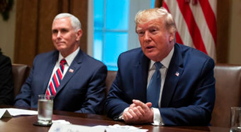 Vice President Mike Pence listens as President Donald Trump speaks during a roundtable on school choice in the Cabinet Room of the White House, Monday, Dec. 9, 2019, in Washington. (AP Photo/ Evan Vucci) Vice President Mike Pence listens as President Donald Trump speaks during a roundtable on school choice in the Cabinet Room of the White House, Monday, Dec. 9, 2019, in Washington. (AP Photo/ Evan Vucci)