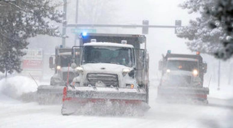 City of Denver snowplows clear the eastbound lanes of Speer Blvd. as a storm packing snow and high winds sweeps in over the region Tuesday, Nov. 26, 2019. (AP Photo/David Zalubowski) City of Denver snowplows clear the eastbound lanes of Speer Blvd. as a storm packing snow and high winds sweeps in over the region Tuesday, Nov. 26, 2019. (AP Photo/David Zalubowski)