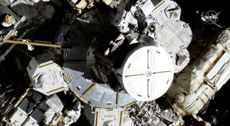 The world’s first female spacewalking team is making history high above Earth. This is the first time in a half-century of spacewalking that a woman floated out without a male crewmate. (NASA via AP)