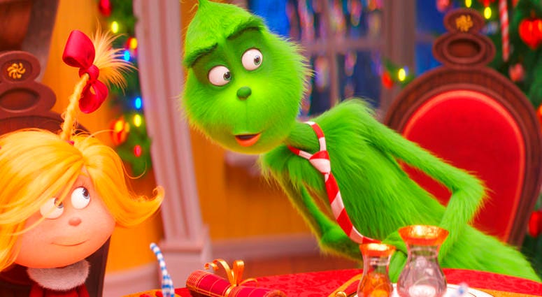 This file image released by Universal Pictures shows the characters Cindy-Lou Who, voiced by Cameron Seely, left, and Grinch, voiced by Benedict Cumberbatch, in a scene from "The Grinch."