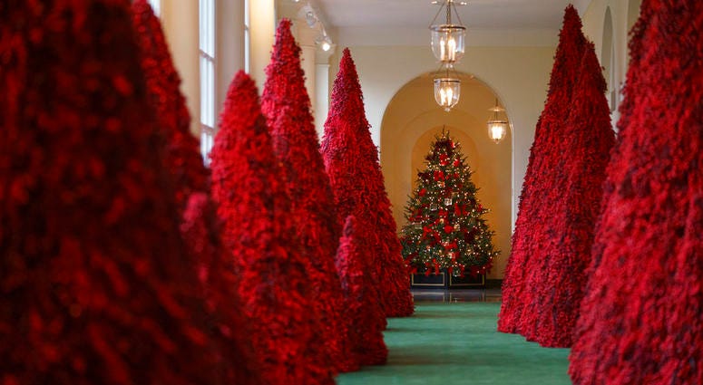 Topiary trees line the East colonnade during the 2018 Christmas Press Preview at the White House in Washington, Monday, Nov. 26, 2018.