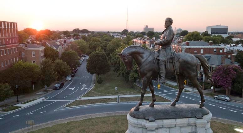 In this July 31, 2017 photo, the sun sets behind the statue of confederate General Robert E. Lee on Monument Avenue in Richmond, Va. (AP Photo/Steve Helber) In this July 31, 2017 photo, the sun sets behind the statue of confederate General Robert E. Lee on Monument Avenue in Richmond, Va. (AP Photo/Steve Helber)