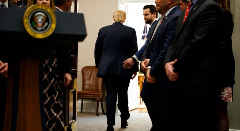 President Donald Trump departs after a signing ceremony for an executive order on a "National Roadmap to Empower Veterans and End Veteran Suicide," in the Roosevelt Room of the White House, Tuesday, March 5, 2019, in Washington. (AP Photo/ Evan Vucci)