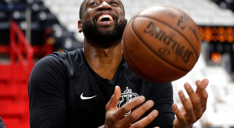 Miami Heat guard Dwyane Wade tosses a basketball before a game against the Philadelphia 76ers, Tuesday, April 9, 2019, in Miami. Wade is playing his final home regular season game before retiring at the end of the season.(AP Photo/Lynne Sladky) Miami Heat guard Dwyane Wade tosses a basketball before a game against the Philadelphia 76ers, Tuesday, April 9, 2019, in Miami. Wade is playing his final home regular season game before retiring at the end of the season.(AP Photo/Lynne Sladky)