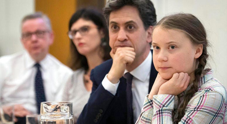 Environment Secretary Michael Gove, left, Former Labour leader Ed Miliband, second right, and Swedish climate activist Greta Thunberg, right, at the House of Commons in Westminster, London. (Stefan Rousseau/PA via AP) Environment Secretary Michael Gove, left, Former Labour leader Ed Miliband, second right, and Swedish climate activist Greta Thunberg, right, at the House of Commons in Westminster, London. (Stefan Rousseau/PA via AP)
