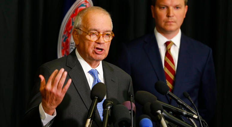 McGuire Woods law firm partner, Richard Cullen, left, gestures as Ben Hatch, right, listen during a news conference in Norfolk, Va., Wednesday, May 22, 2019. (AP Photo/Steve Helber)