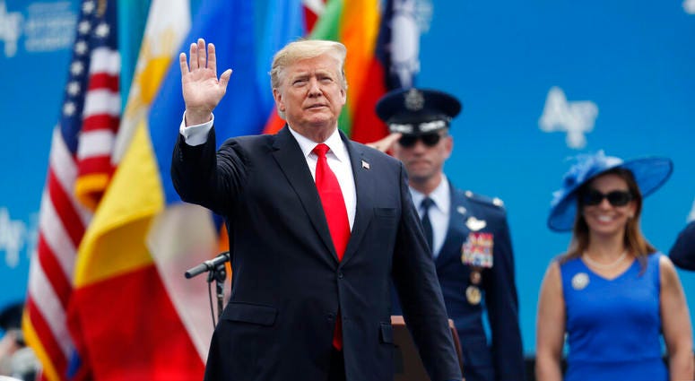 President Donald Trump waves as he takes the stage to speak at the U.S. Air Force Academy graduation Thursday, May 30, 2019 at Air Force Academy, Colo. (AP Photo/David Zalubowski)