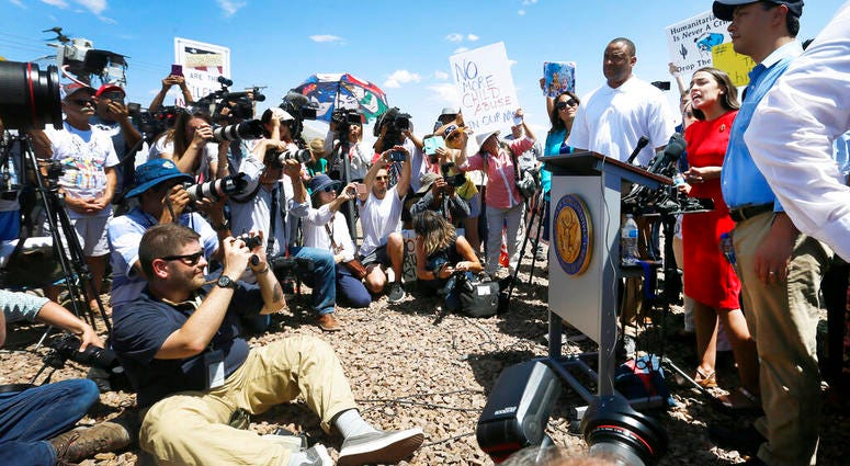 U.S. Rep. Alexandria Ocasio-Cortez, D-New York, talks about what she saw on her tour of area border facilities Monday, July 1, at the Border Patrol station in Clint. Ocasio-Cortez was attempting to talk over the protesters. (Briana Sanchez / El Paso Times