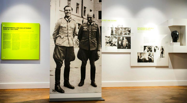 In this Friday, July 12, 2019 photo a picture of Claus Schenk Graf von Stauffenberg, left, and Albrecht Ritter Merz von Quirnheim is displayed a the exhibition at the German Resistance Memorial Center inside the Bendlerblock building of the defensive mini