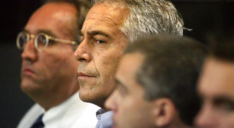 FILE - In this July 30, 2008, file photo, Jeffrey Epstein, center, appears in court in West Palm Beach, Fla. Federal prosecutors, preparing for a bail fight Monday, July 15, 2019, say evidence against Epstein is growing “stronger by the day” after several