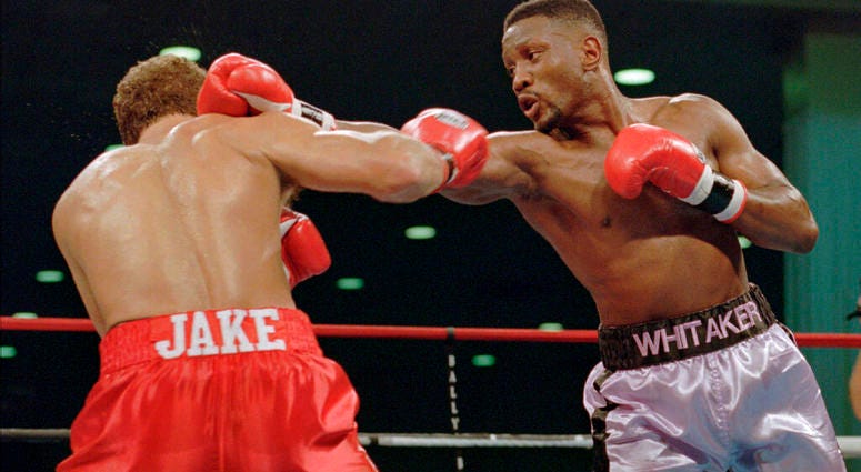 In this Nov. 18, 1995, file photo, WBC welterweight champion Pernell "Sweet Pea" Whitaker, right, delivers a right to the head of challenger Jake Rodriguez during their scheduled 12 round bout in Atlantic City, N.J. (AP Photo/Donna Connor, File)