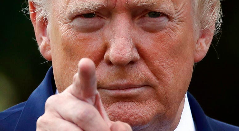 President Donald Trump points to a reporter for a questions as he speaks with reporters on the South Lawn of the White House before departing, Friday, July 19, 2019, in Washington. (AP Photo/Alex Brandon)