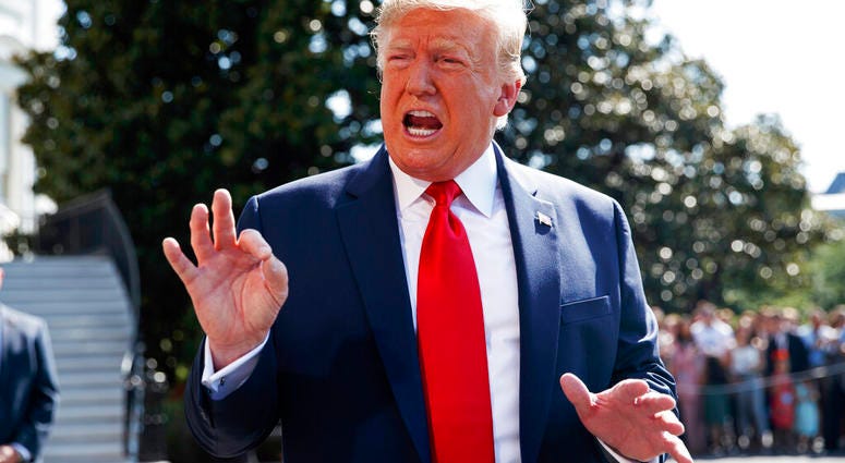 President Donald Trump talks to reporters on the South Lawn of the White House, Friday, Aug. 9, 2019, in Washington, as he prepares to leave Washington for his annual August holiday at his New Jersey golf club. (AP Photo/Evan Vucci)