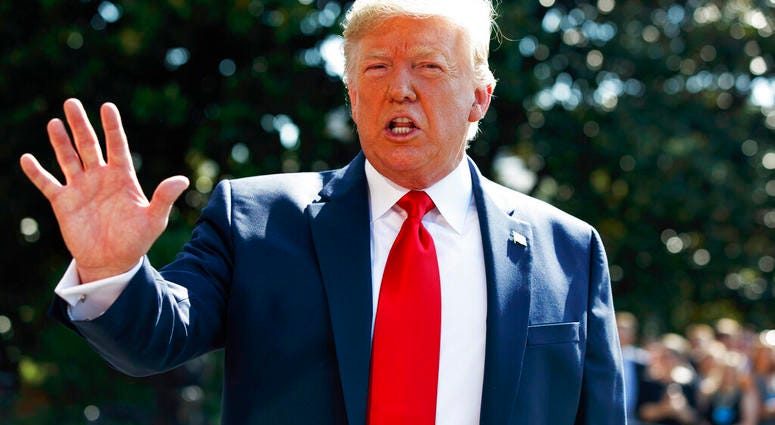 President Donald Trump talks to reporters on the South Lawn of the White House, Friday, Aug. 9, 2019, in Washington, as he prepares to leave Washington for his annual August holiday at his New Jersey golf club. (AP Photo/Evan Vucci)